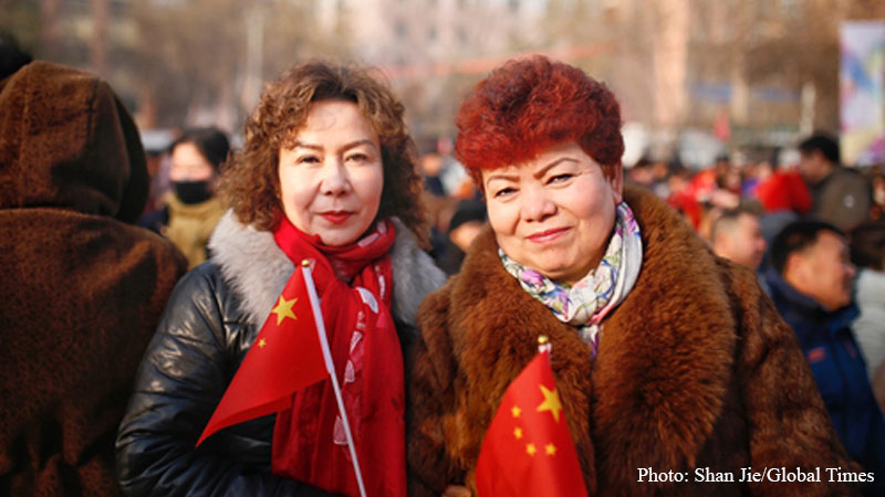 Women, Chinese national flag, Baicheng, Xinjiang, Uyghur