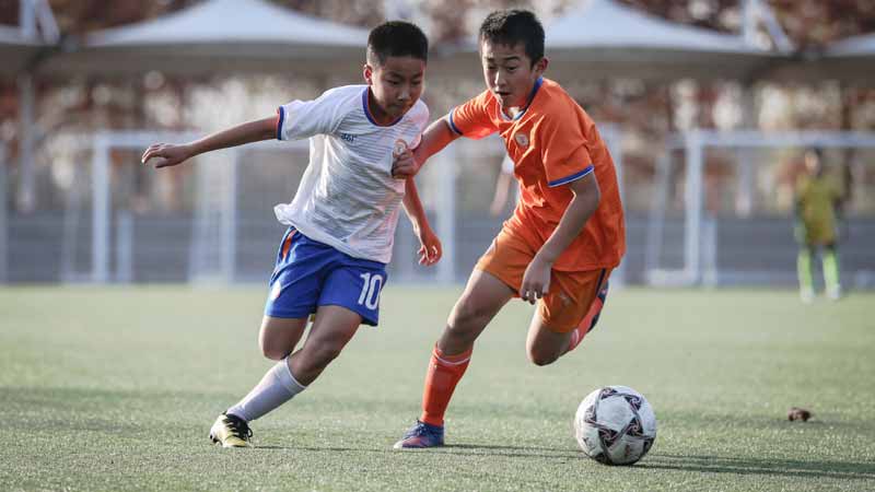 Young players during a training game in Luneng soccer school Photo: Courtesy of Shandong Taishan Football Club