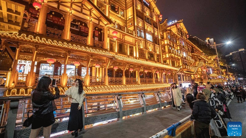 Tourists visit a commercial street in Yuzhong District in southwest China's Chongqing Municipality, Feb. 10, 2023. Chongqing has launched a variety of activities at nighttime to boost night economy since the beginning of this year.(Photo: Xinhua)