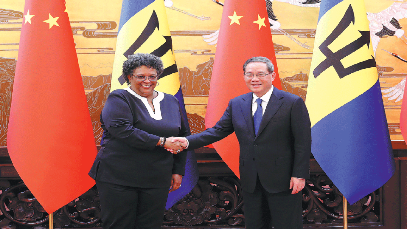 China’s Premier Li Qiang and Barbados' Prime Minister Mia Mottley shake hands at the Great Hall of the People in Beijing on Sunday. Mottley is on an official visit to China. Wang Zhuangfei / China Daily
