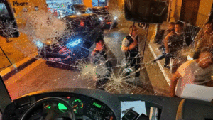 Black-clad rioters surround and smash the windscreen of a bus ferrying Chinese tourists in Marseille, France, late June 29, 2023. Photo: Courtesy of a Chinese tourist surnamed Li