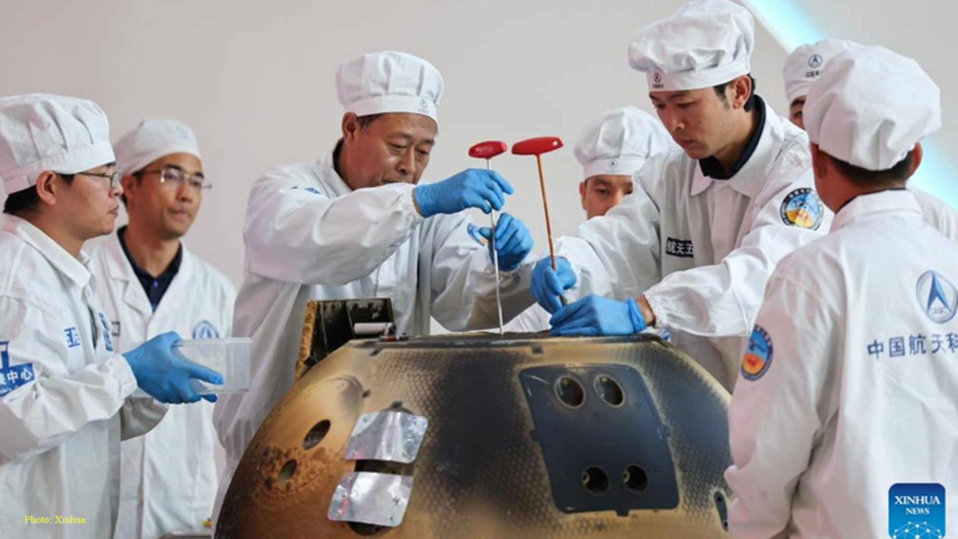 The returner of the Chang'e-6 lunar probe is opened during a ceremony at the China Academy of Space Technology under the China Aerospace Science and Technology Corporation in Beijing, capital of China, June 26, 2024. The returner of the Chang'e-6 lunar probe was opened at a ceremony in Beijing on Wednesday afternoon. During the ceremony at the China Academy of Space Technology under the China Aerospace Science and Technology Corporation, researchers opened the returner and examined key technical indicators.(Photo: Xinhua)